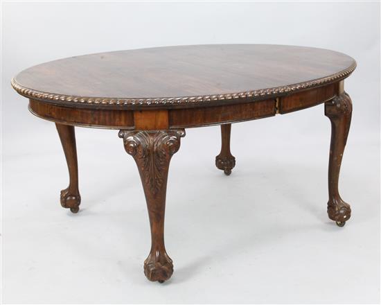 1930s Chippendale revival mahogany extending oval dining table with three additional leaves(-)